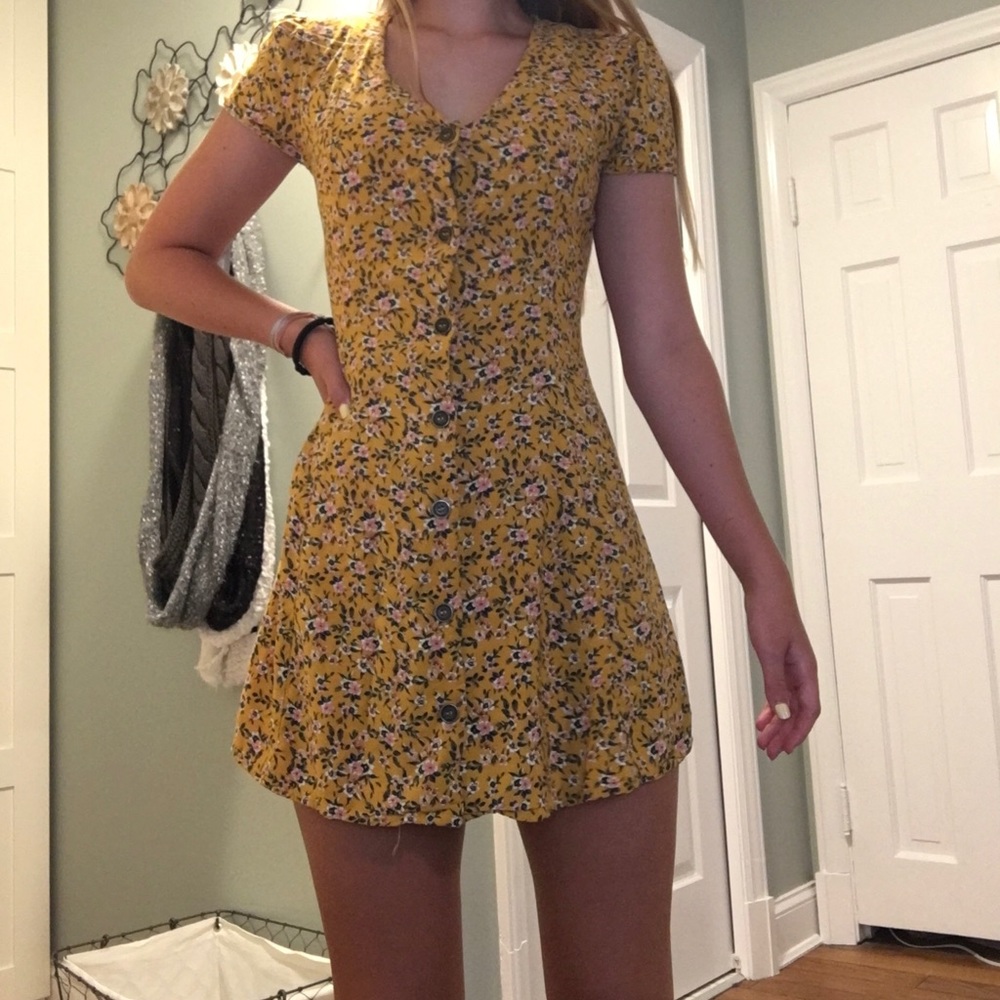 Yellow flower button down dress.